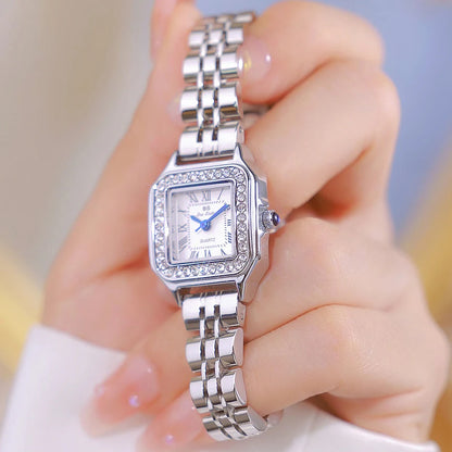 HER GOLD BRACELET WATCH