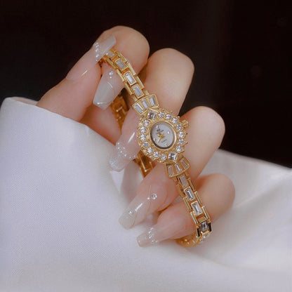 RICH GOLD BRACELET WATCH